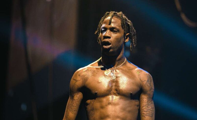 Travis Scott Gets Inked With a Tiger Tattoo in Eerie ‘DUMBO’ Video: Watch